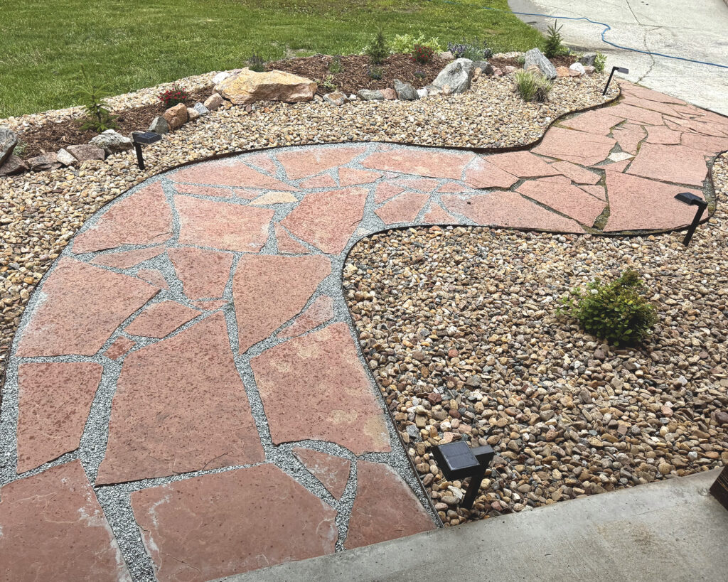 filling in flagstone cracks with crushed granite pea gravel