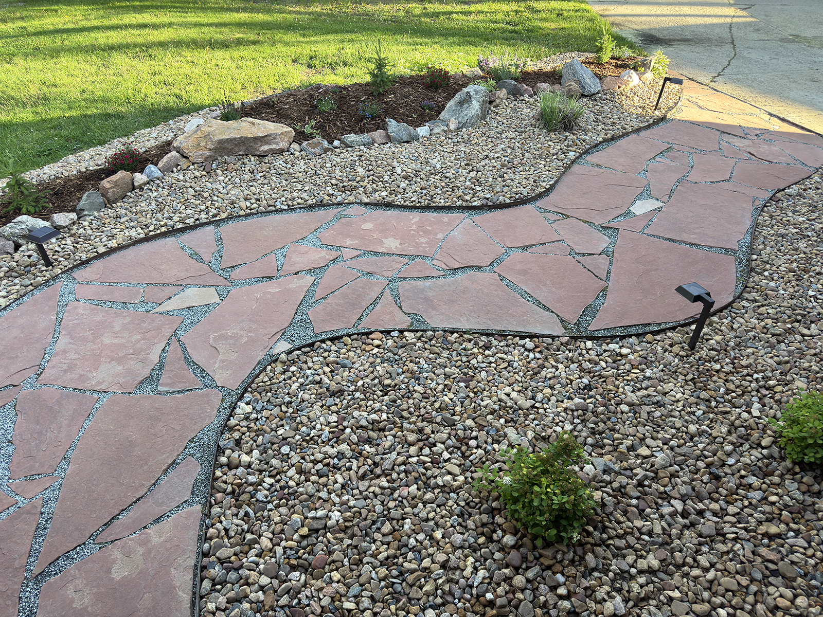 after filling in cracks of flagstone with crushed granite pea gravel