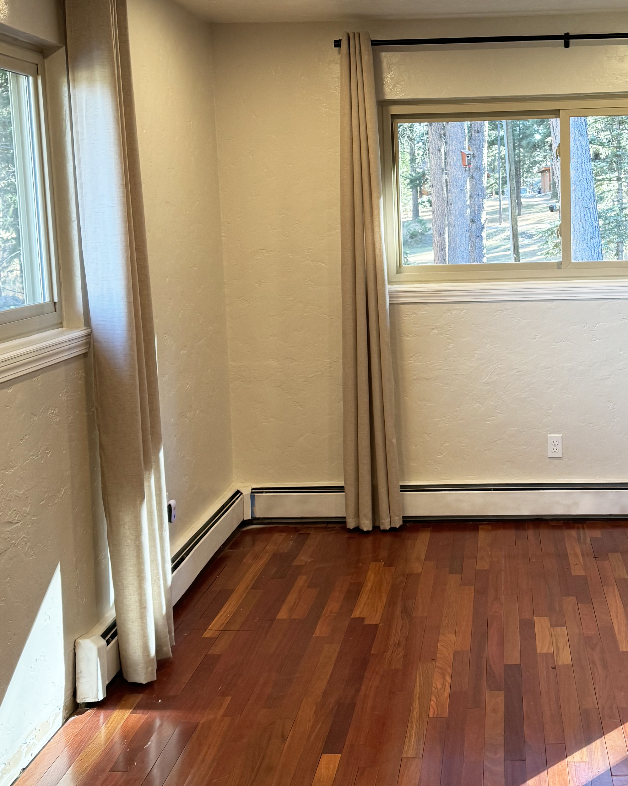 Old baseboard heater in bedroom