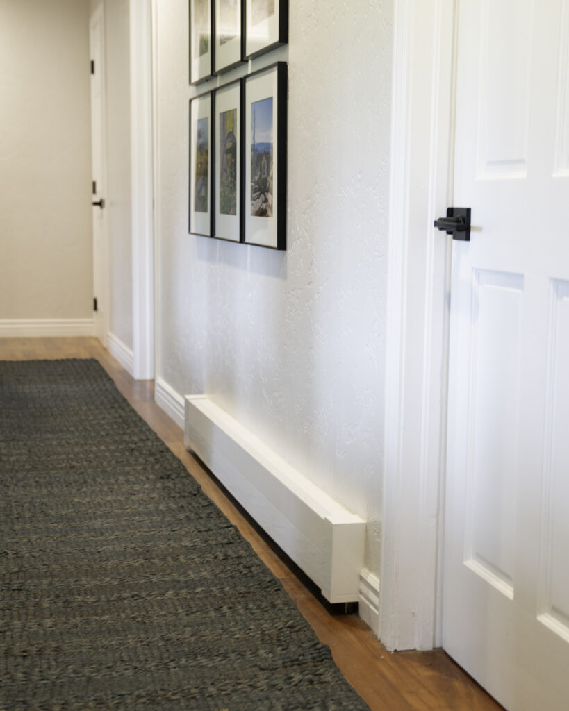 New modern baseboard heat covers in hallway