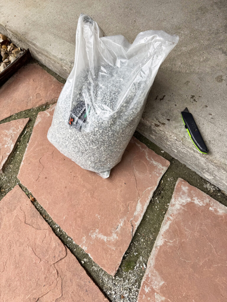 crushed granite pea gravel used to fill in flagstone pathway pavers